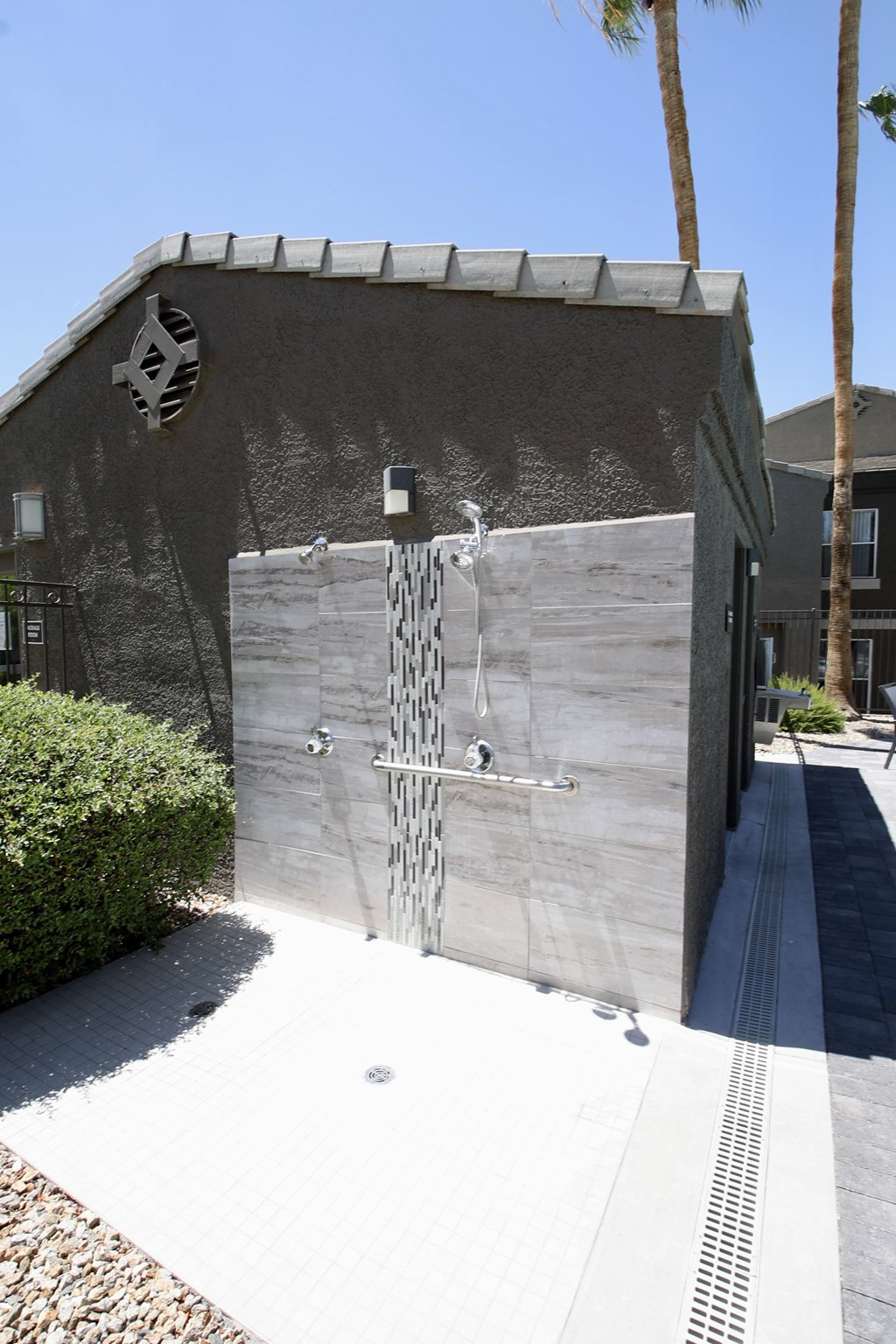 Exterior pool side tiled shower.