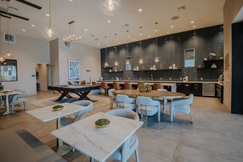 Resident clubhouse with pool table, fire place, lounge seating, long bar at Level 25 at The Curve by Picerne, Las Vegas, 89148