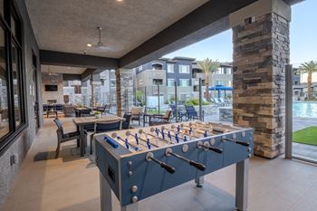 Foosball table on a large patio overlooking the pool at Level 25 at The Curve by Picerne, Las Vegas, Nevada