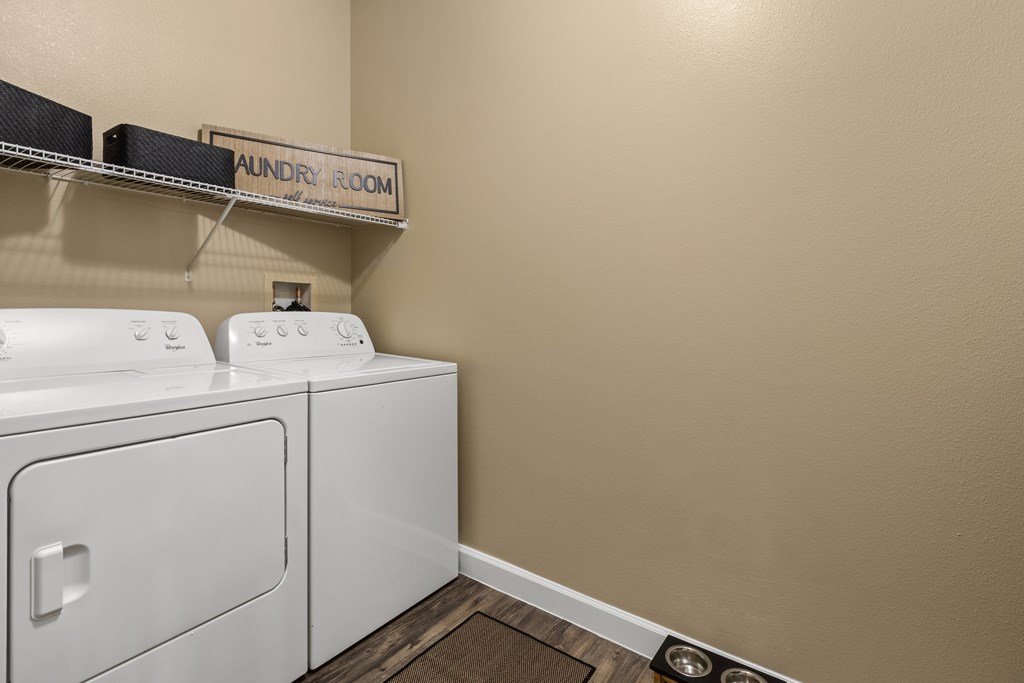 A laundry room with a washer and dryer.