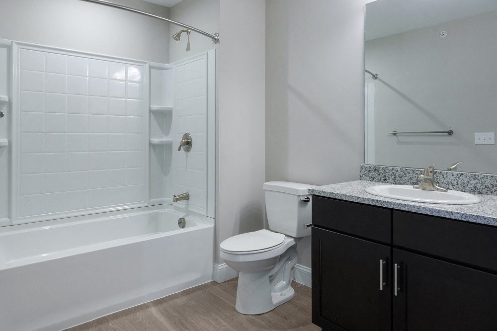 a bathroom with a sink toilet and a shower