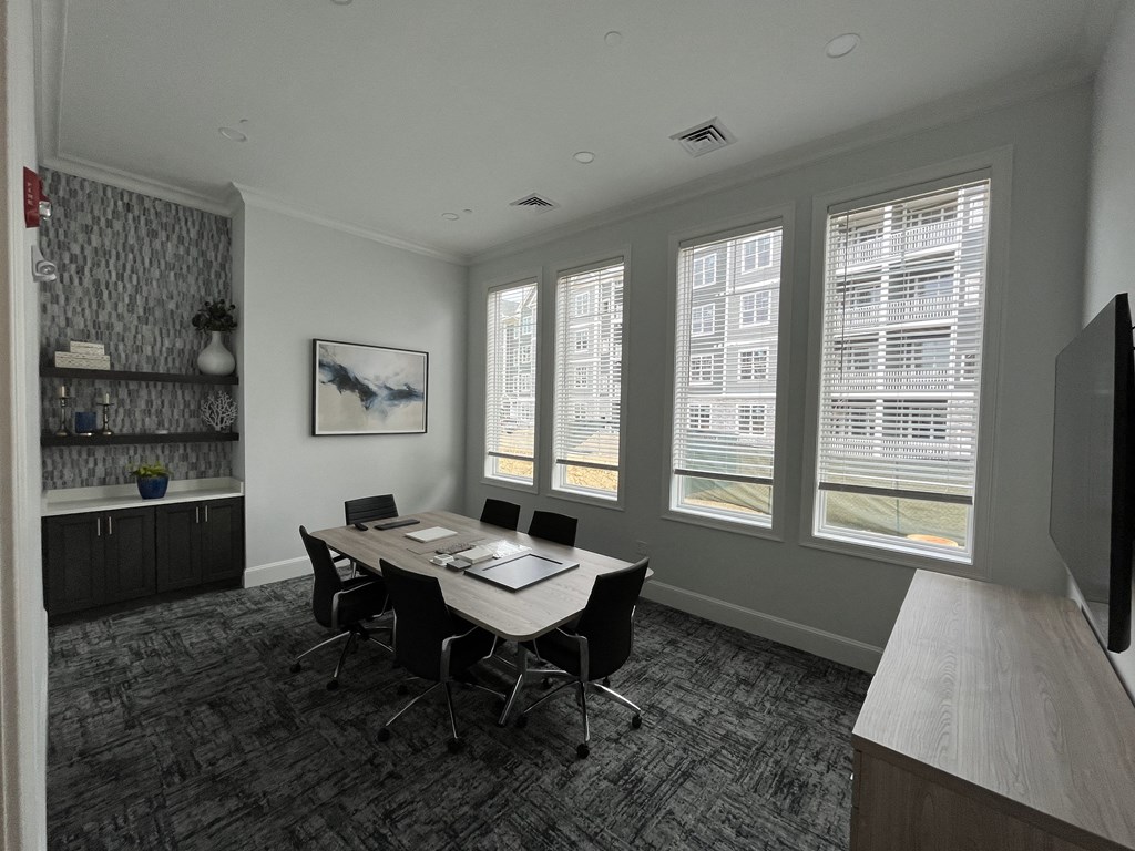 a room with a table and chairs and a wall of windows at Plymouth, Plymouth, MA, 02360