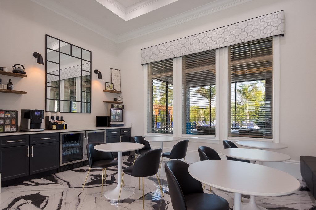 a room filled with furniture and a large window  at The Oasis at Manatee River, Bradenton, FL, 34211