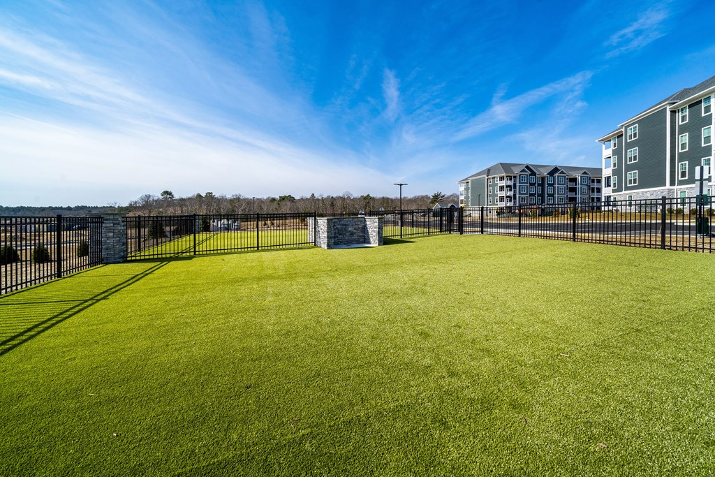 a large grassy area with a soccer goal in the middle of it at The Oasis at Plymouth, Plymouth, MA