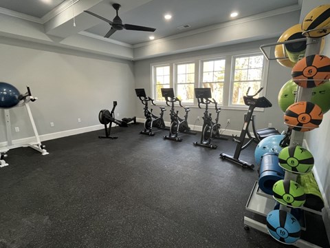 A spacious home gym with a variety of exercise equipment.