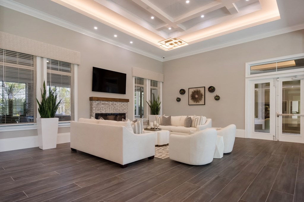 a living room with a coffered ceiling and hardwood flooring  at The Oasis at Manatee River, Bradenton, FL, 34211