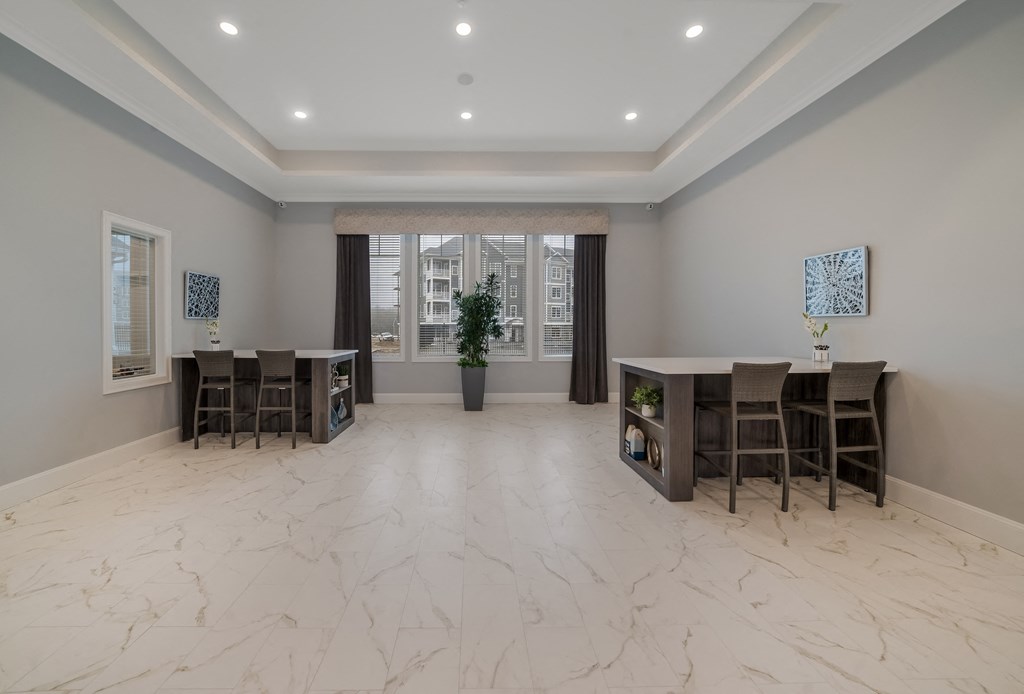 a dining room with a table and chairs and a window