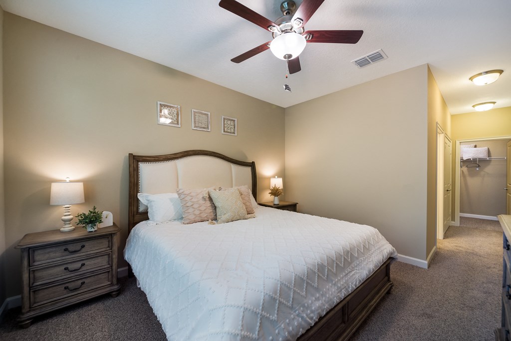 a bedroom with a large bed and a ceiling fan at The Oasis at Highwoods Preserve, Tampa, FL