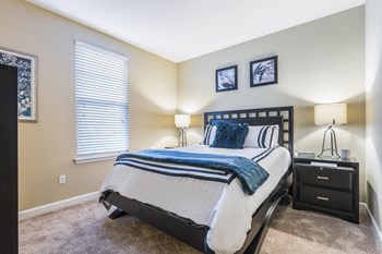 Bedroom with cozy bed Bedroom with cozy bed at The Oasis at Brandon, Florida - Photo Gallery 6