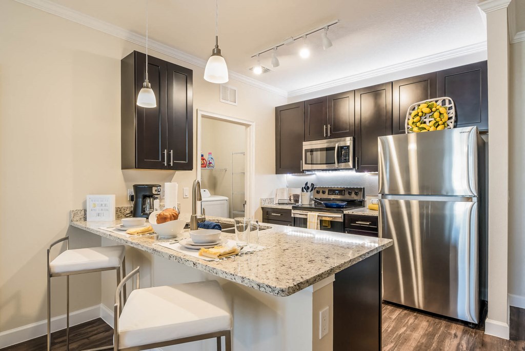 Gourmet Kitchen With Island at The Oasis at Moss Park Preserve, Orlando, Florida