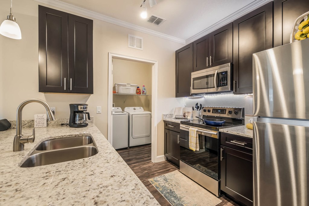 Granite Counter Tops In Kitchen at The Oasis at Moss Park Preserve, Orlando