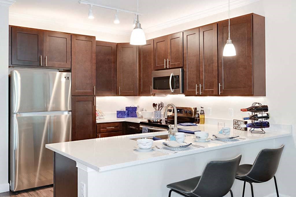 Gourmet Kitchen With Island at The Oasis at Cypress Woods, Fort Myers