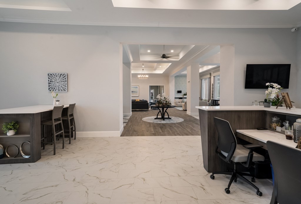 a view of a living room and a dining room with a table and chairs