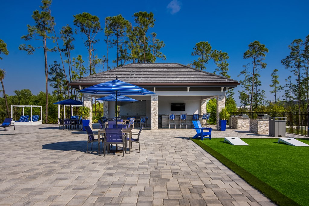 a large pavilion with a seating area and a bar  at The Oasis at Manatee River, Bradenton