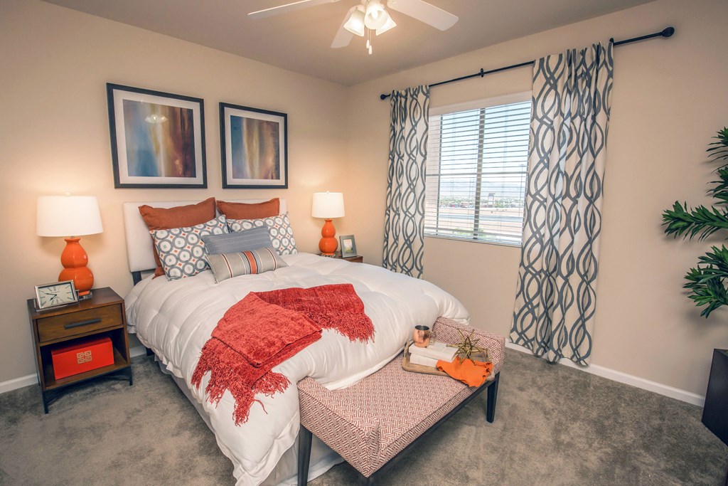 a bedroom with a large bed and a window