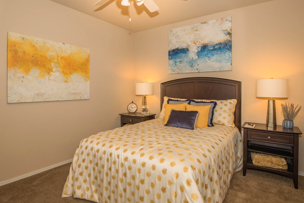 Bedroom with yellow light and frame at The Aliante by Picerne, Arizona