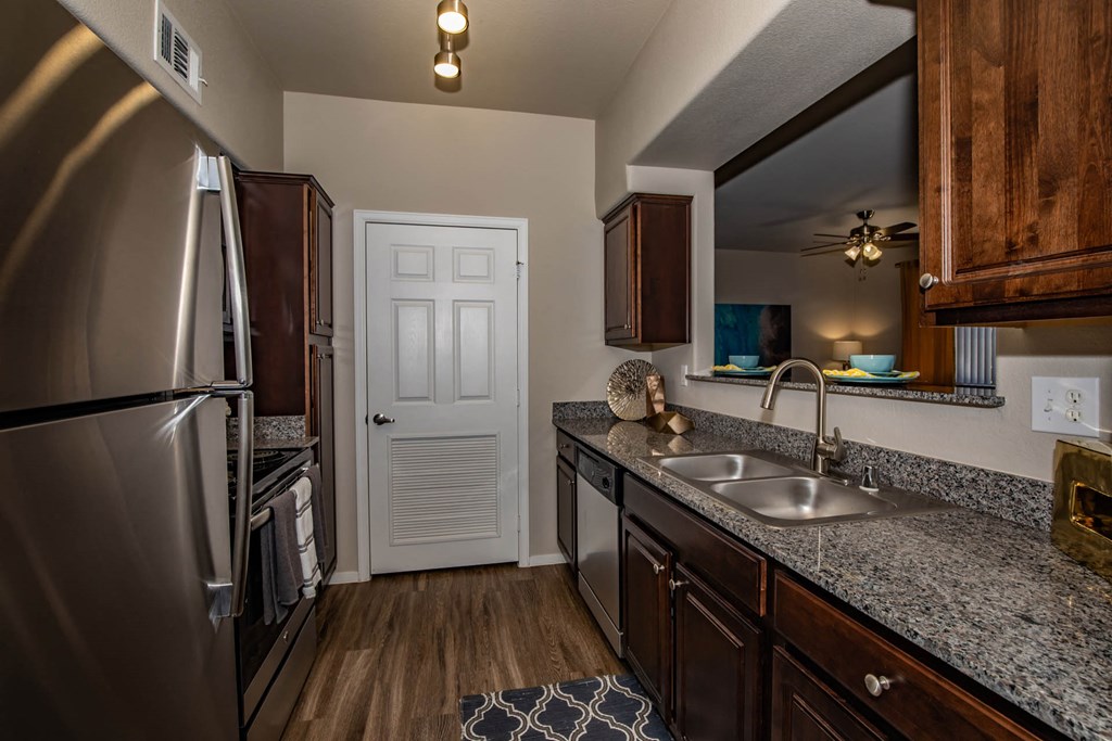 Kitchen with appliances and cabinets at The Belmont by Picerne, Las Vegas