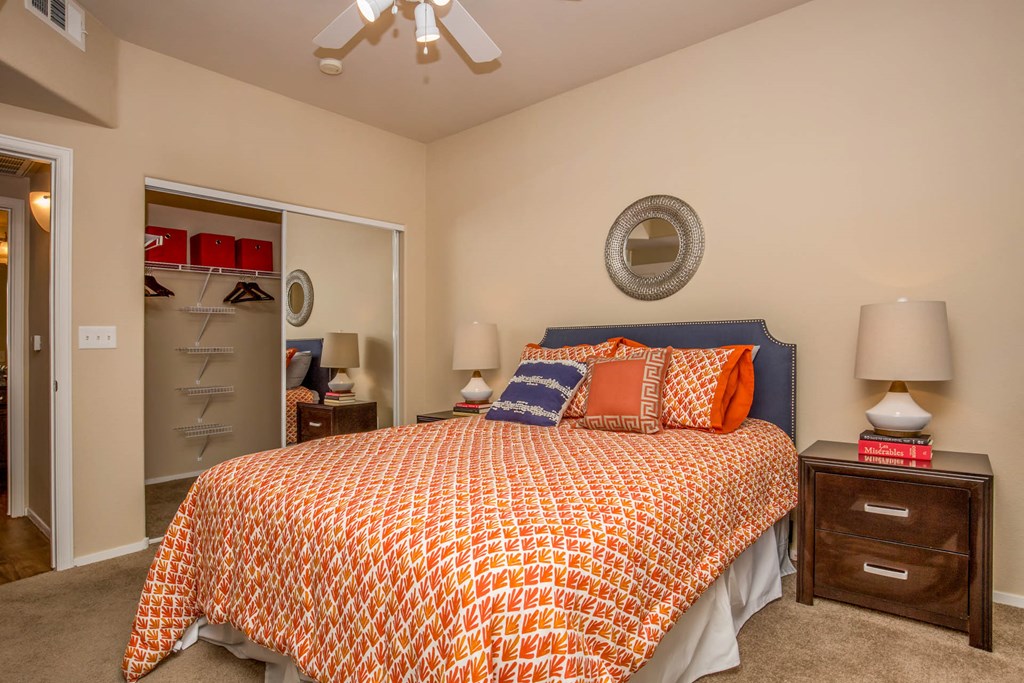 Bedroom with cozy bed and ceiling fan at The Belmont by Picerne, Las Vegas