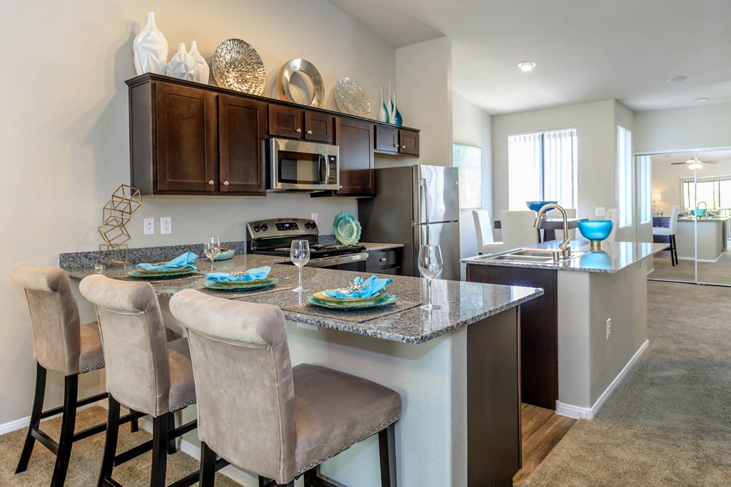 Kitchen wide view with cabinets and appliances at The Cantera by Picerne, Nevada, 89139