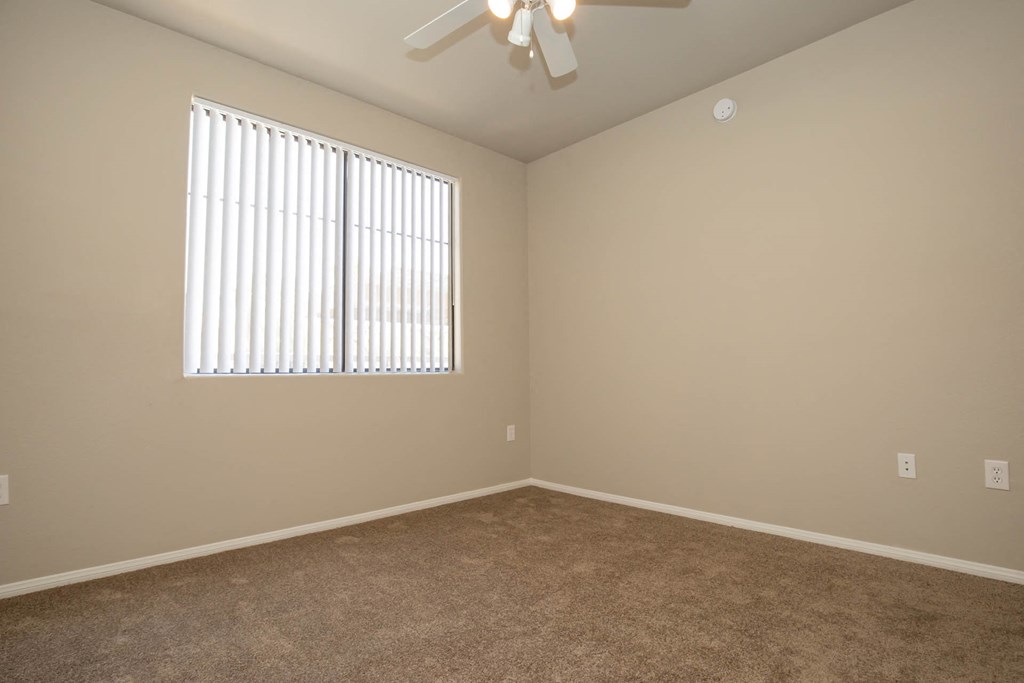 Unfurnished room with wooden floor and ceiling fan at The Cantera by Picerne, Las Vegas, Nevada