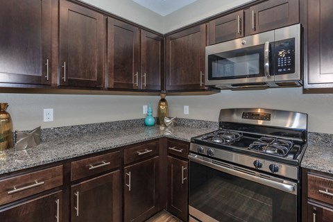 Wooden cabinets in kitchen at Level 25 at Durango by Picerne, Nevada, 89113