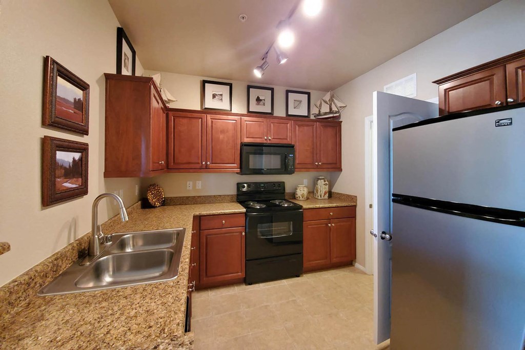 Kitchen Bar With Granite Counter Top at The Paramount by Picerne, Las Vegas, Nevada