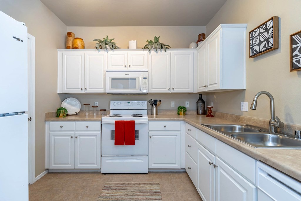 white appliances in kitchen at The Paseo by Picerne, Goodyear, AZ