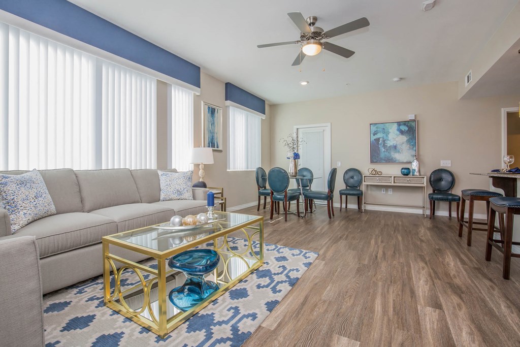 Living Room With Dining Area at The Passage Apartments by Picerne, Henderson, 89014