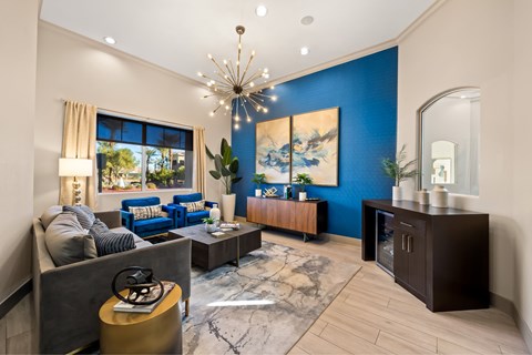 Leasing waiting area with couches and refreshments at The Fairways by Picerne Apartments, Nevada, 89141
