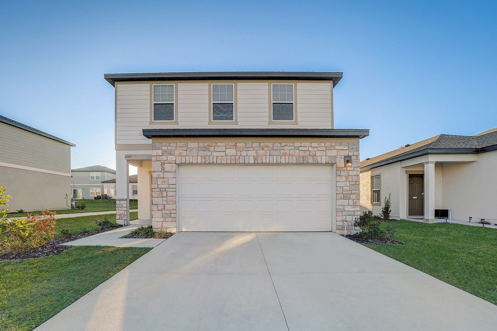 Front view from the driveway of the Maple floor plan at Beacon at Clinton Corners, Rental Homes in Dade City, FL