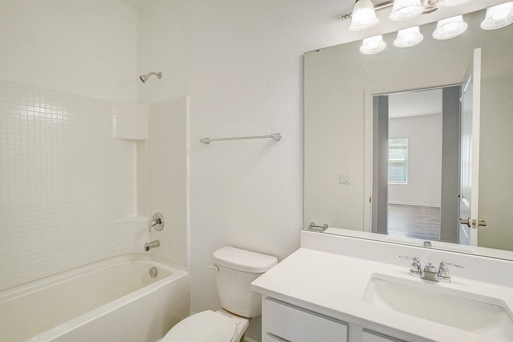 Bathroom in the Elm floor plan with white counters at Beacon at Clinton Corners in Dade City, FL