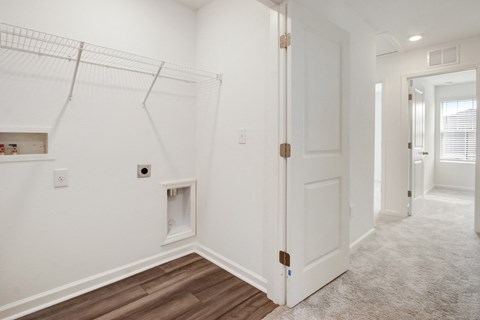 Efficient and organized laundry closet at Beacon at Arbours in Ruskin, FL