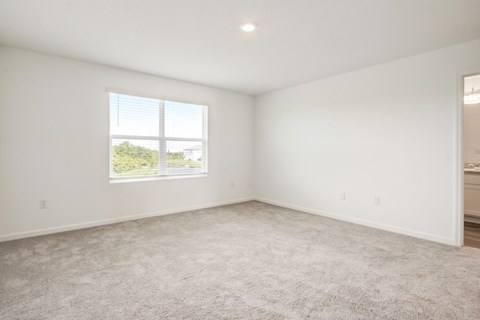 Unfurnished master bedroom with ample space at Beacon at Arbours in Ruskin, FL