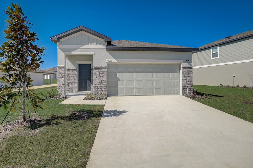 Front view from the driveway of the Elm floor plan at Beacon at Clinton Corners in Dade City, FL