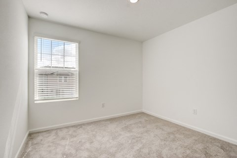 Third bedroom with white walls and a window area at Beacon at Arbours in Ruskin, FL