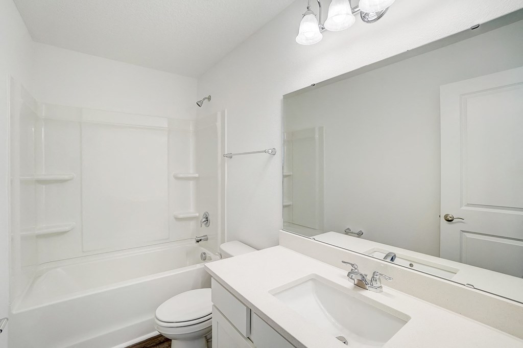 Bathroom with white counters of the Verbena floor plan at Beacon at Clinton Corners in Dade City, FL