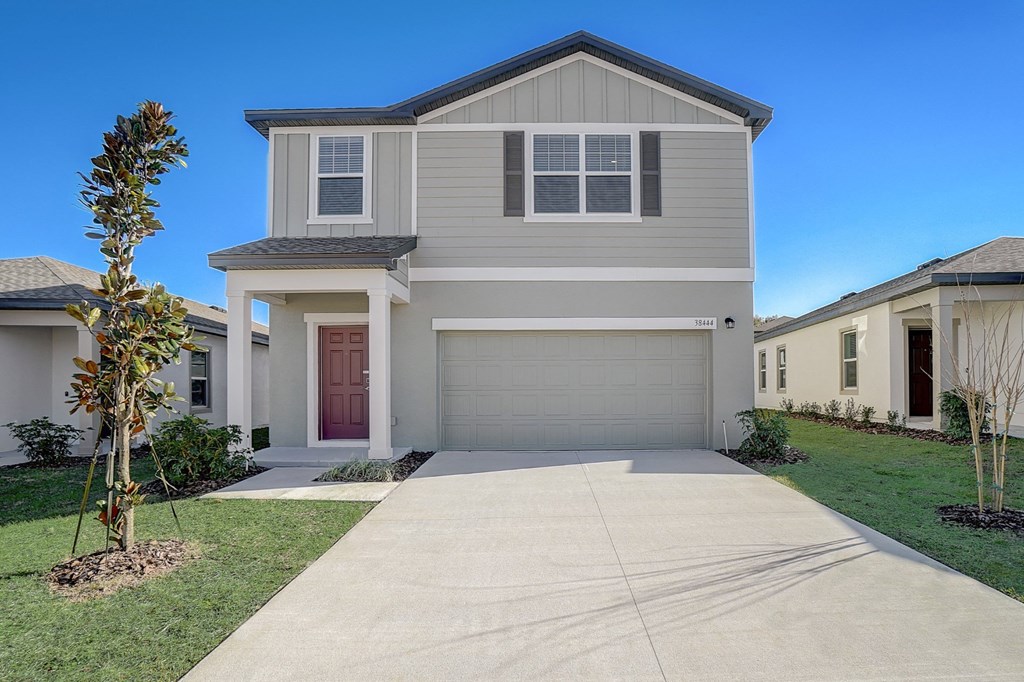 Front view from the driveway of the Verbena floor plan at Beacon at Clinton Corners, rental homes in Dade City, FL