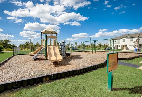 Children's playground with modern equipment at Beacon at Arbours in Ruskin, FL