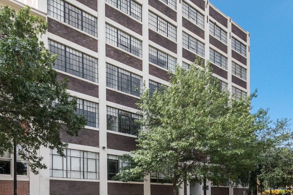 a large building with trees in front of it