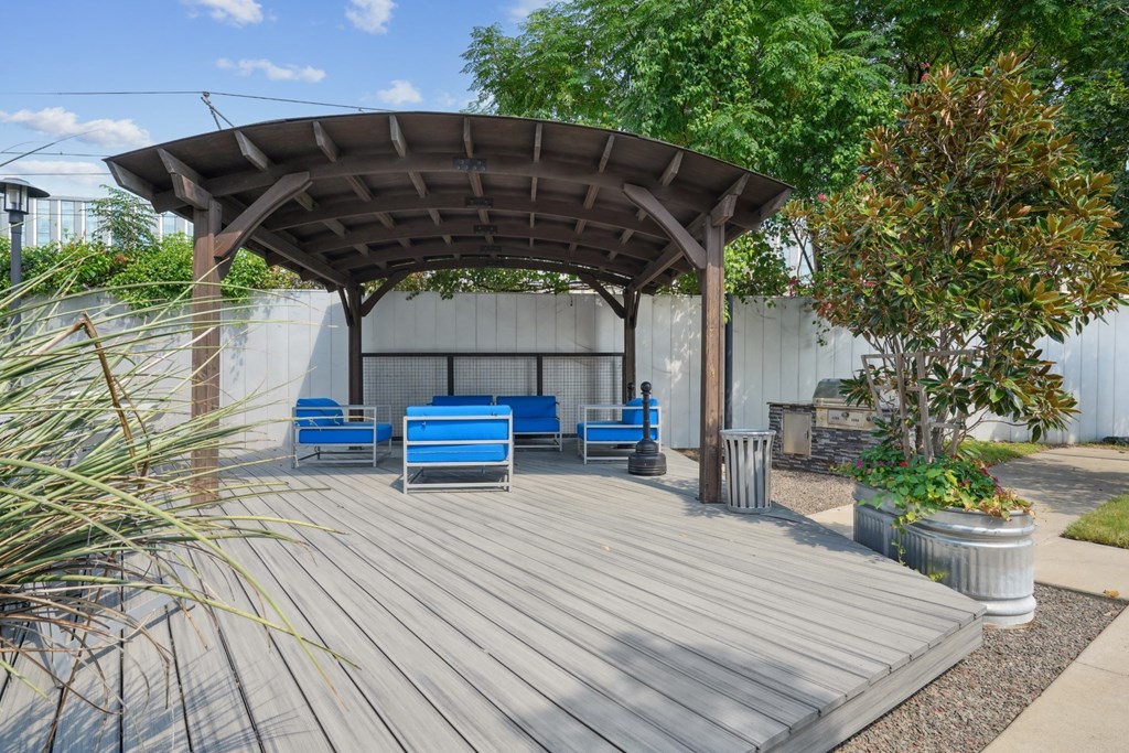 3333 Elm Street patio with shaded seating  with blue chairs | Deep Ellum Lofts in Dallas, TX