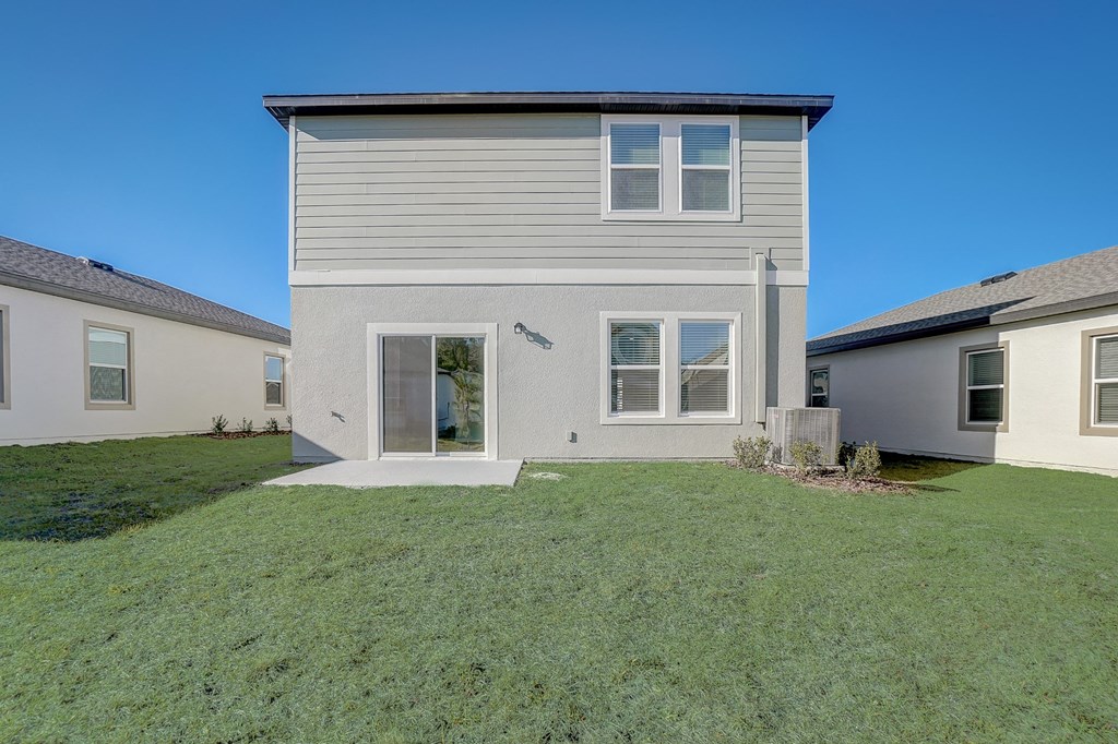View of the Verbena floor plan house from the backyard at Beacon at Clinton Corners in Dade City, FL