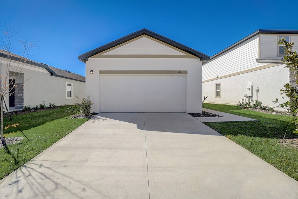 Front view from the driveway of the Aspen floor plan at Beacon at Clinton Corners, Rental Homes in Dade City, FL
