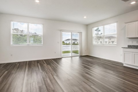 Open-concept living and kitchen area at Beacon at Arbours in Ruskin, FL