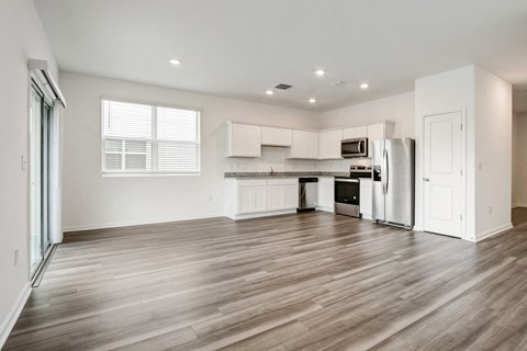 View from living room to kitchen at Beacon at Arbours in Ruskin, FL
