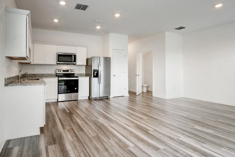 Spacious living and kitchen area with modern design at Beacon at Arbours in Ruskin, FL