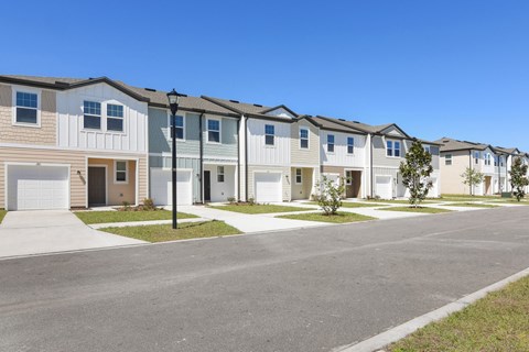 a row of townhomes with a street in front of them  at Beacon at Arbours, Ruskin, FL, 33570
