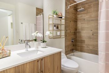 Designer tiled bathrooms with contemporary finishes and fixtures at Alameda West, Florida
