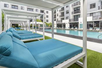 Tropical pool deck with large sundeck and cabanas at Alameda West, Miami, 33144