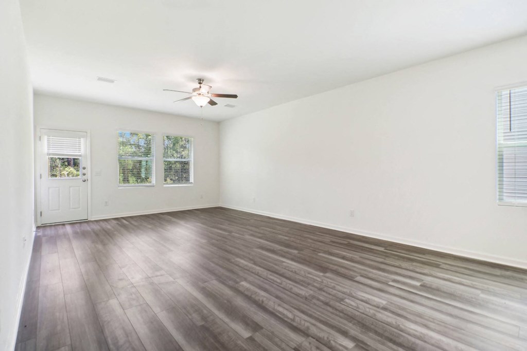 Bright and open living area with large windows at Beacon at Ashley River Landing in Summerville, SC