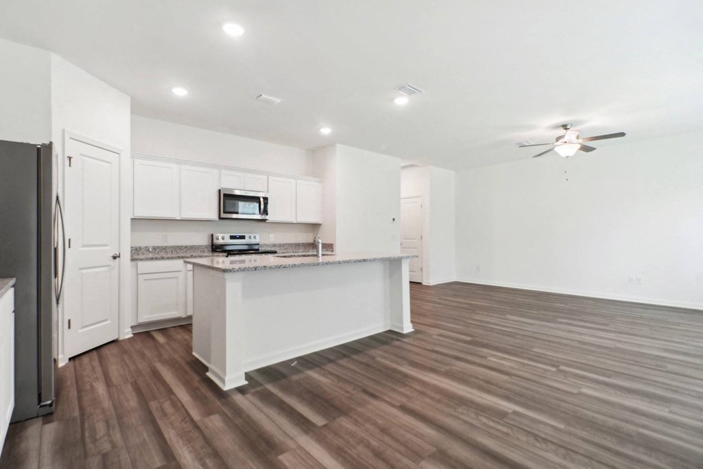 Maple open kitchen and a ceiling fan at Beacon at Ashley River Landing in Summerville, SC